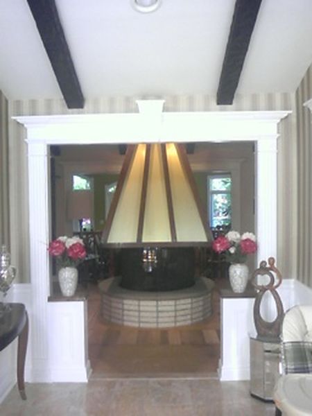 Trimmed opening with pilasters, header and half-walls built by DMM Carpentry